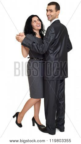 Couple dance, studio portrait on white. Dressed in black suit.