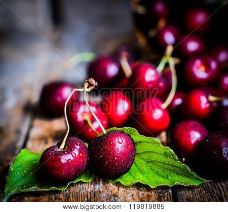 Cherries On Rustic Wooden Background