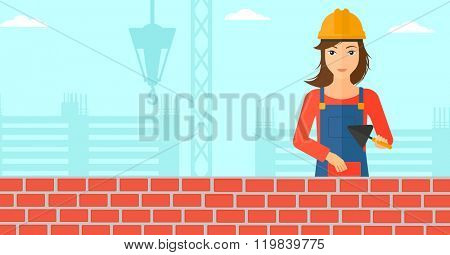 Bricklayer with spatula and brick.