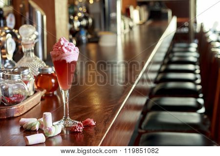Fancy champagne cocktail with blood orange foam