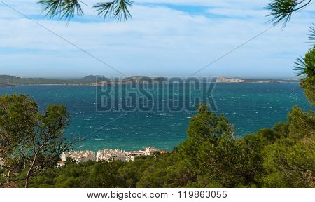 Hill side view from St Antoni de Portmany, Ibiza, into balearic sea on a clearing day in November, f