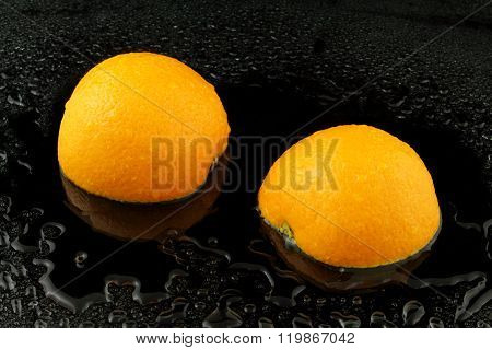 A Divided Apfelsine On Black Background