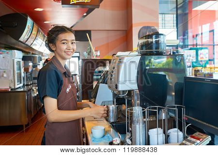 PATTAYA, THAILAND - FEBRUARY 25, 2016: worker at McCafe in Thailand. McCafe is a coffee-house-style food and drink chain, owned by McDonald's.