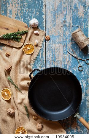 Cast iron frying pan skillet empty form on vintage table