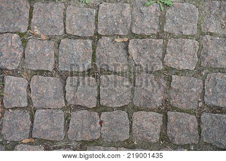 Close view of granite setts road pavement