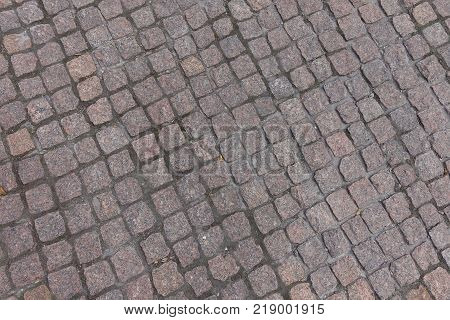 Dusty dry granite setts with diagonal joints