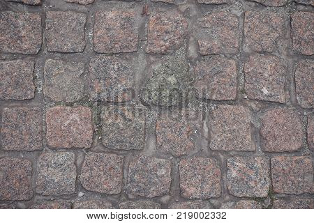 Rows of dusty granite setts from above