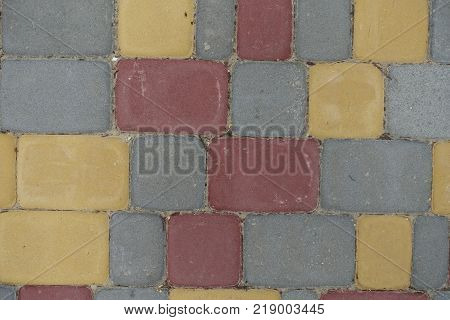Multicolored rectangular concrete pavement blocks from above