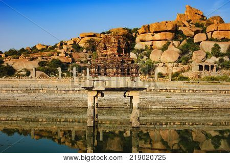 Pushkarani is a sacred lake on the way to the Vitthala temple in Hampi, Karnataka, India. The pond served to the ritual and functional aspects of the temple and life surrounding it.