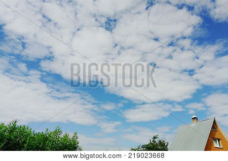 Blue sky with white clouds on a clear summer day