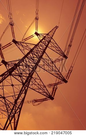 Electricity Pylons In Silhouette At Sunest Drax Power Station Yorkshire England
