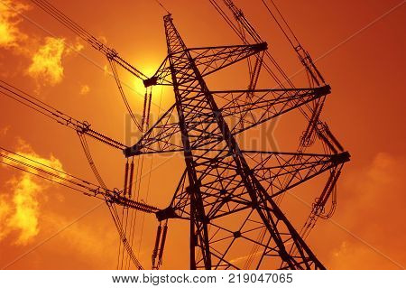 Electricity Pylons In Silhouette At Sunest Drax Power Station Yorkshire England