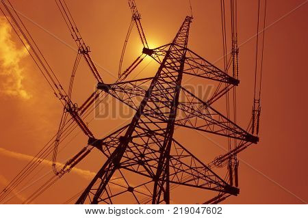 Electricity Pylons In Silhouette At Sunest Drax Power Station Yorkshire England