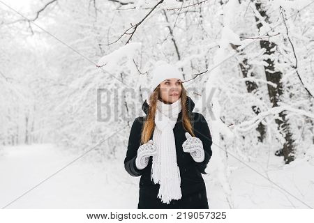 Beautiful Young Girl In A White Winter Forest