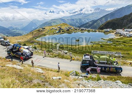 Col de la Croix de Fer France - 25 July 2015: Bostik caravan driving on the road to the Col de la Croix de Fer in Alps during the stage 20 of Le Tour de France 2015.