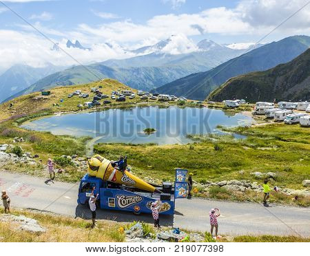 Col de la Croix de Fer France - 25 July 2015: Cornetto truck driving on the road to the Col de la Croix de Fer in Alps during the stage 20 of Le Tour de France 2015.