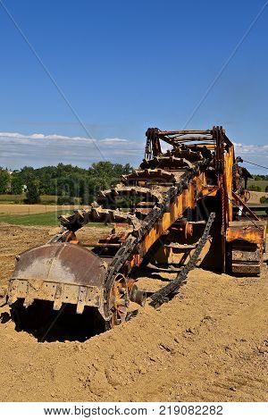 An antique trencher for digging trenches deep into the ground.