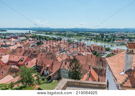 Ptuj / Slovenia - August 17, 2017: View of the old town, the river Drawa and the lake from the castle in Ptuj in the summer of 2017