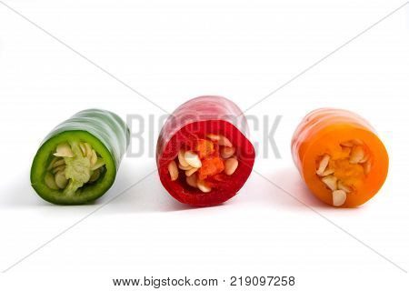 Colorful mix of chili pappers on white background.