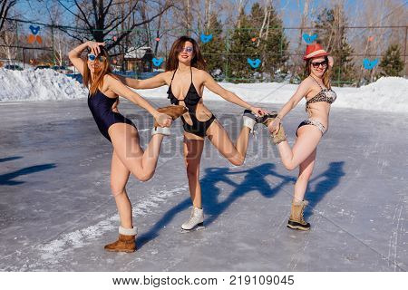 Novokuznetsk, Kemerovo region, Russia - 23 Feb, 2017 : White beaches of Siberia is an enterteiment activity where people playing beach games dressed in bikini in winter. Women in bikini on ice skates