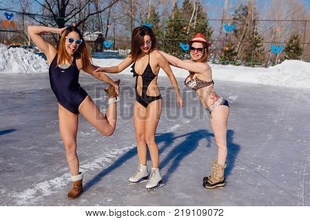 Novokuznetsk, Kemerovo region, Russia - 23 Feb, 2017 : White beaches of Siberia is an enterteiment activity where people playing beach games dressed in bikini in winter. Women in bikini on ice skates