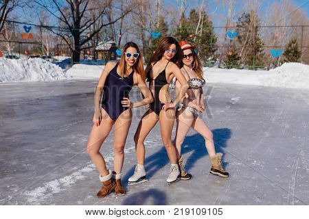 Novokuznetsk, Kemerovo region, Russia - 23 Feb, 2017 : White beaches of Siberia is an enterteiment activity where people playing beach games dressed in bikini in winter. Women in bikini on ice skates