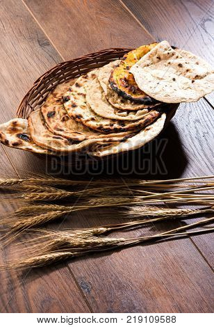 Assorted Indian Bread Basket includes chapati, tandoori roti or naan, paratha, kulcha, fulka, missi roti