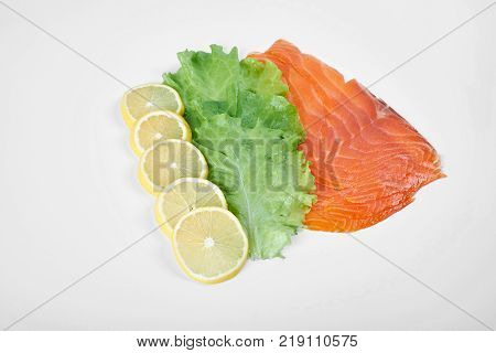 Smoked Fillet salmon with lemon and salad isolated on white background.
