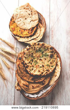 Assorted Indian Bread Basket includes chapati, tandoori roti or naan, paratha, kulcha, fulka, missi roti