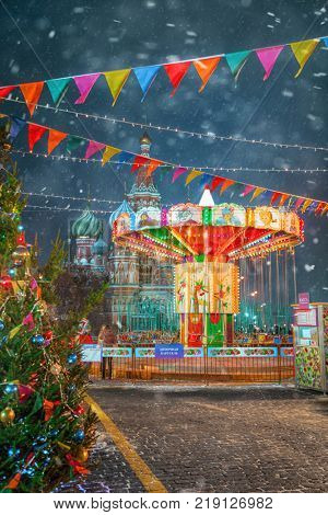 Moscow, Russia - December 5, 2017: Christmas tree and carousel Trade House GUM on Red Square in Moscow, Russia
