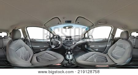 GRODNO BELARUS - OCTOBER 12 2017: Full 360 by 180 degree seamless equirectangular equidistant spherical panorama in interior of prestige modern car Ravon white background. Skybox for vr ar content