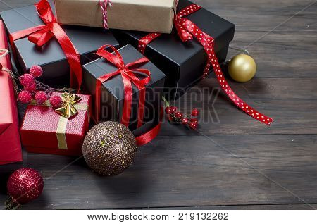 Red Christmas  Gift  Box With Red Ribbon And Fir Branches