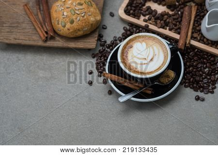 Morning coffeeLatte coffee in cup on tablevintage tone.