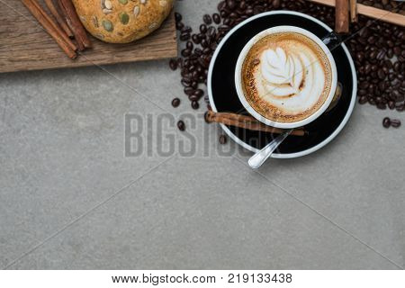 Morning coffeeLatte coffee in cup on tablevintage tone.