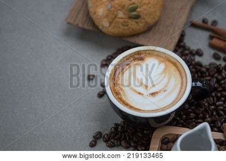 Morning coffeeLatte coffee in cup on tablevintage tone.