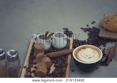 Morning coffeeLatte coffee in cup on tablevintage tone.