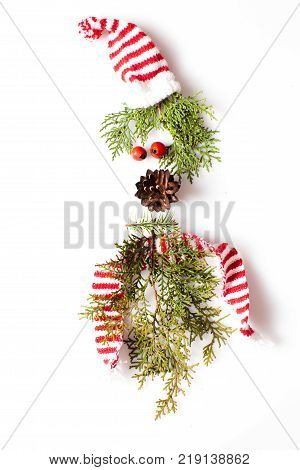 Gnome or elf face from natural materials. Christmas silhouette picture in minimalistic design concept