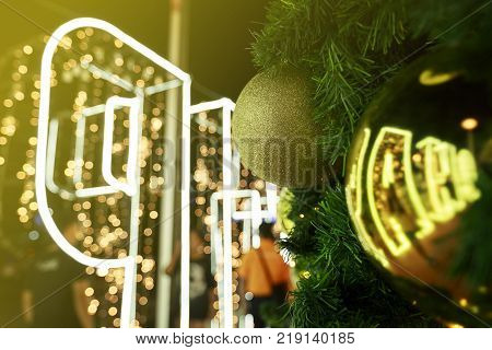 Christmas decorations on tree with lighting at night time