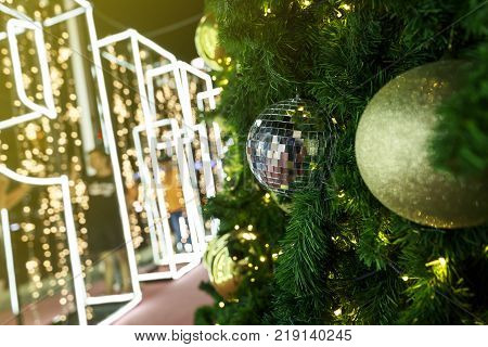 Christmas decorations on tree with lighting at night time