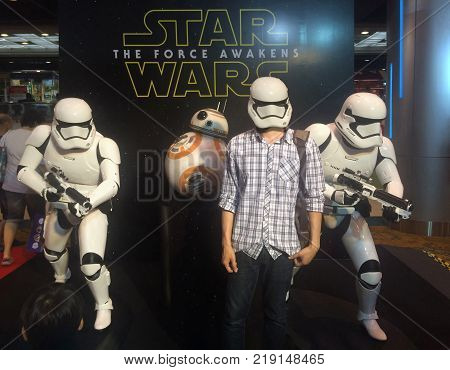 Bangkok Thailand - February 17 2016 : People enjoy taking photo with stormtroopers and droid replica The fictional character of Star Wars on travel fair day at QSNCC