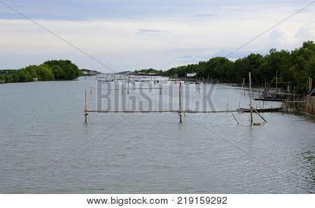 The canal with fish poles Folk fishing Samut Sakorn Thailand.