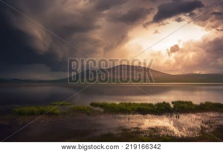 Beautiful dark storm clouds over lake, georgia, Caucasus