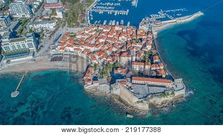 Old Town Budva with Morgen beach, Aerial view from sky. Montenegro
