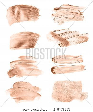 Set of liquid foundation strokes isolated on white background