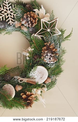 Christmas wreath on rustic wooden background. Christmas