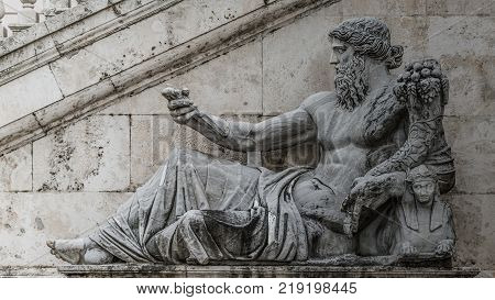 Statue of Neptune at Piazza del Campidoglio Rome Italy dramatic scenery