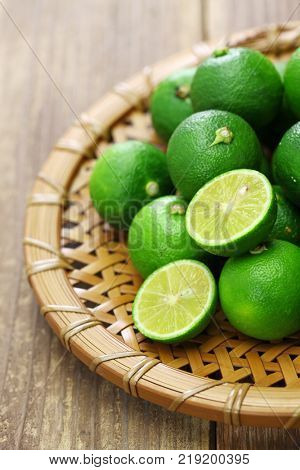 sudachi, japanese citrus fruit, is served as garnish with many traditional japnaese dishes
