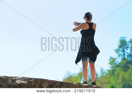 Woman taking photos of Path of Gods Amalfi coast Italy