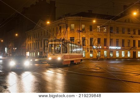 SAINT PETERSBURG, RUSSIA - NOVEMBER 03, 2014: Night tram in the center Saint Petersburg (between 1924 and 1991 named Leningrad). St. Petersburg was founded by Tsar Peter the Great on 1703.