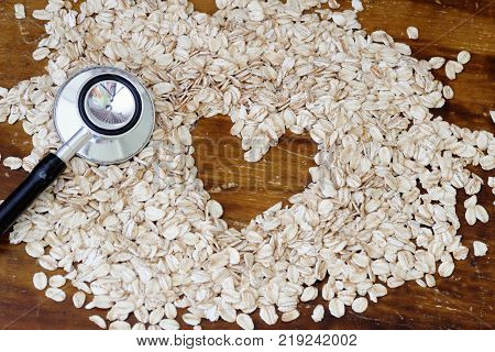 Fitness and health concept. Stethoscope, rolled oat and heart shape